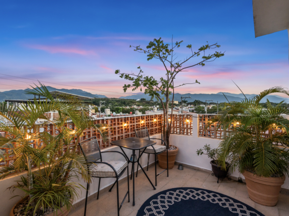 View from patio of El Santuario, a three level Puerto Vallarta home featuring terraces, modern finishes, and mountain views.